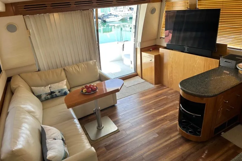 Slide: The Image of Interior of 2000 Carver 530 Voyager Pilothouse with cozy seating and modern amenities. - 17