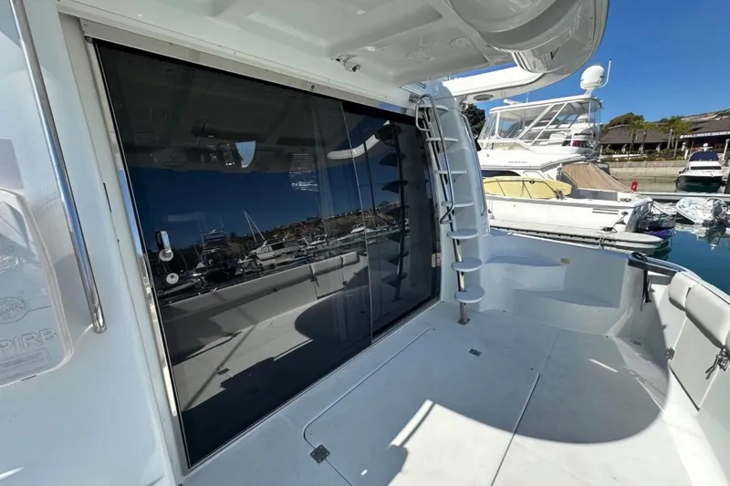 Slide: The Image of 2000 Carver 530 Voyager Pilothouse yacht with sleek deck and marina view. - 18