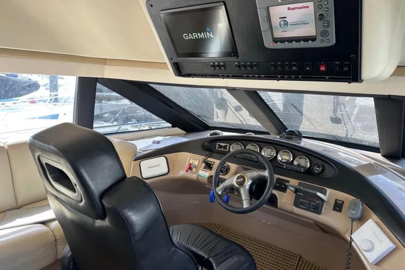 Slide: The Image of Pilothouse interior of 2000 Carver 530 Voyager with Garmin and Raymarine navigation systems. - 19