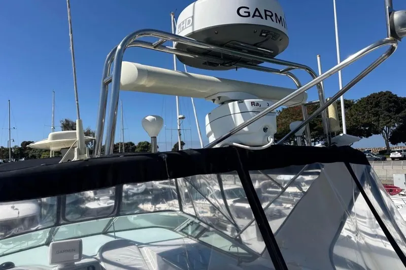 Slide: The Image of 2000 Carver 530 Voyager Pilothouse with Garmin radar, docked in a marina. - 26
