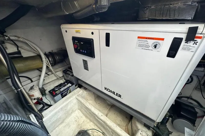 Slide: The Image of Engine room of 2000 Carver 530 Voyager Pilothouse with Kohler generator. - 29
