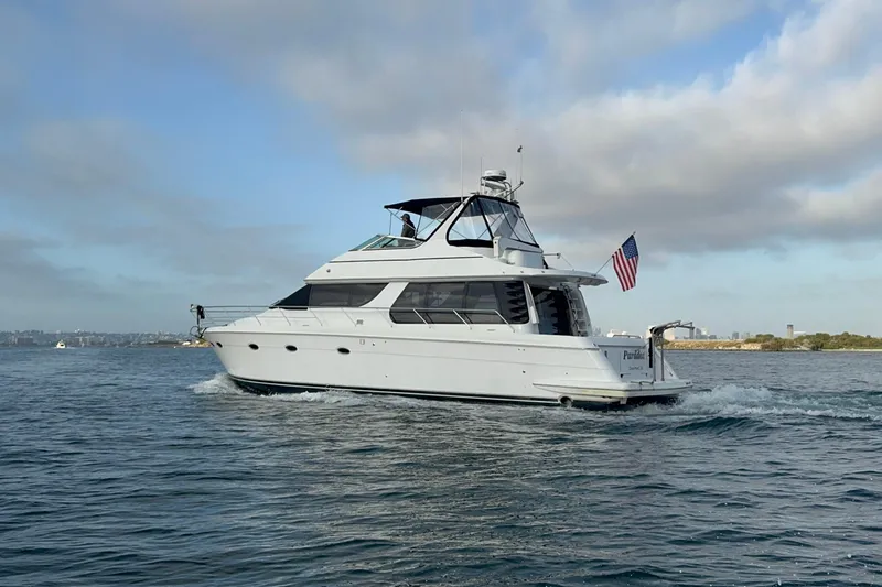 Slide: The Image of 2000 Carver 530 Voyager Pilothouse yacht cruising on open water. - 3