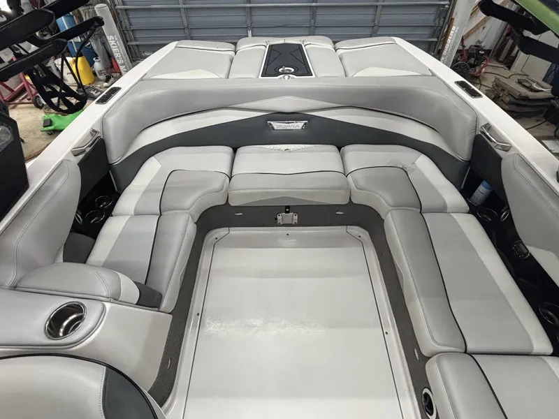 Slide: The Image of Interior of a 2013 Supra Launch SA350 boat with gray upholstery. - 14