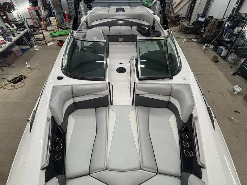 Slide: The Image of Interior view of 2013 Supra Launch SA350 boat in a workshop. - 16