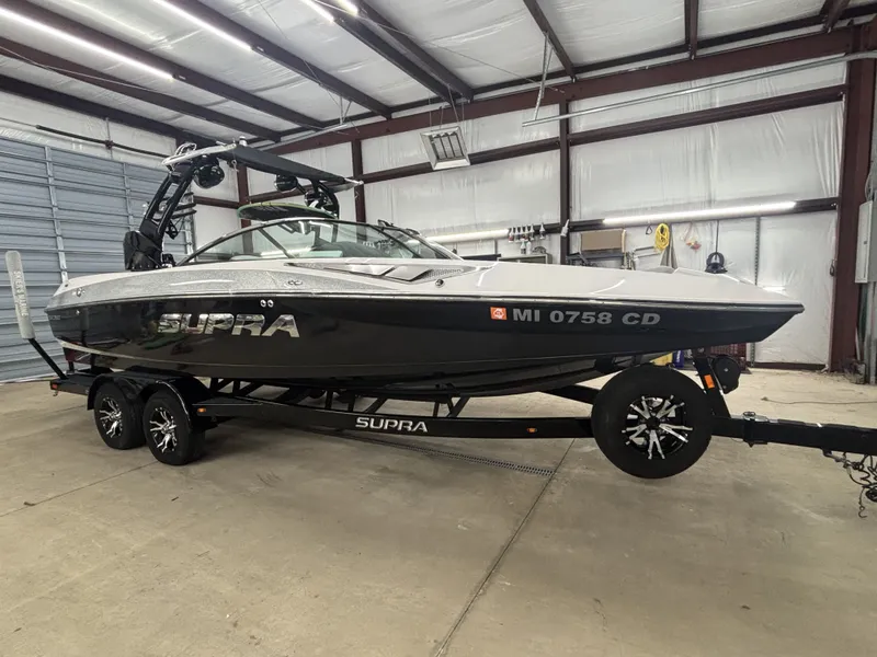 Slide: The Image of 2013 Supra Launch SA350 boat in warehouse. - 3