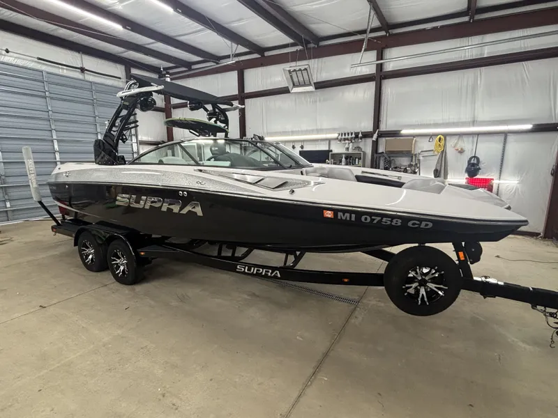 Slide: The Image of 2013 Supra Launch SA350 boat in warehouse. - 5