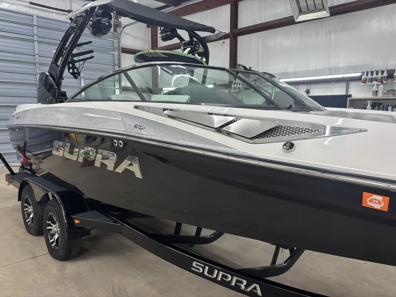 Slide: The Image of 2013 Supra Launch SA350 boat in warehouse. - 7