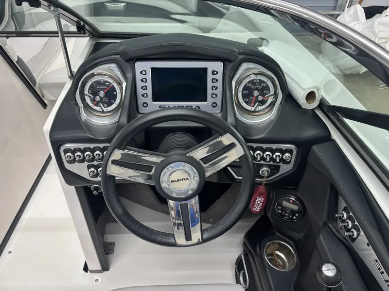 Slide: The Image of Dashboard of the 2013 Supra Launch SA350 boat. - 9