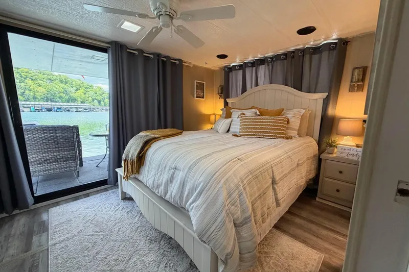 Slide: The Image of Cozy bedroom on 1988 STARDUST houseboat with lake view, featuring elegant decor and natural light. - 27