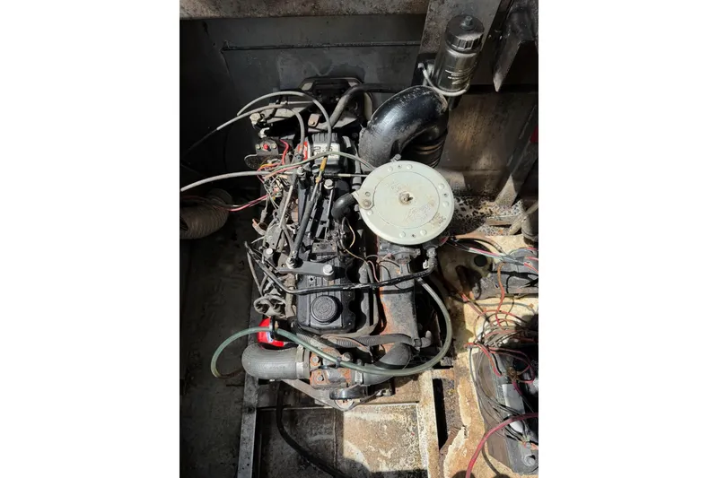 Slide: The Image of Engine of a 1988 STARDUST 16x70 boat, showing wiring and components. - 39
