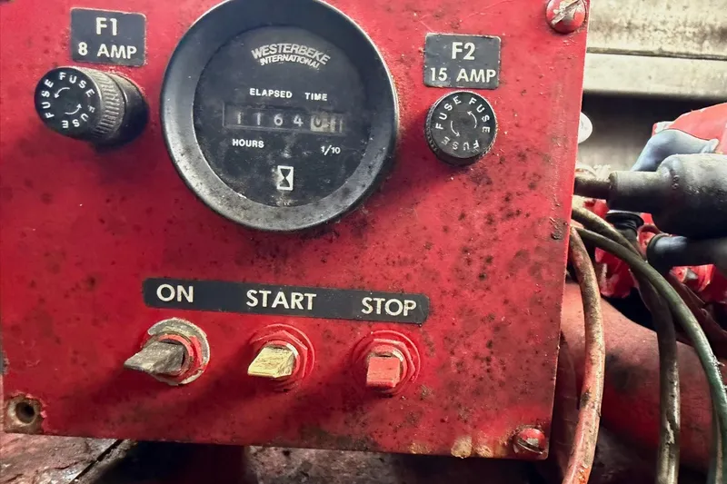 Slide: The Image of Red control panel with switches and hour meter on a 1988 STARDUST 16x70. - 40
