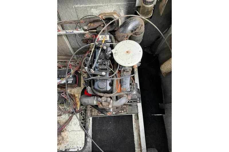 Slide: The Image of Engine compartment of a 1988 STARDUST 16x70, showing mechanical components and wiring. - 41