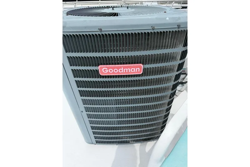 Slide: The Image of Outdoor Goodman air conditioning unit on a STARDUST 16x70, 1988 model. - 43