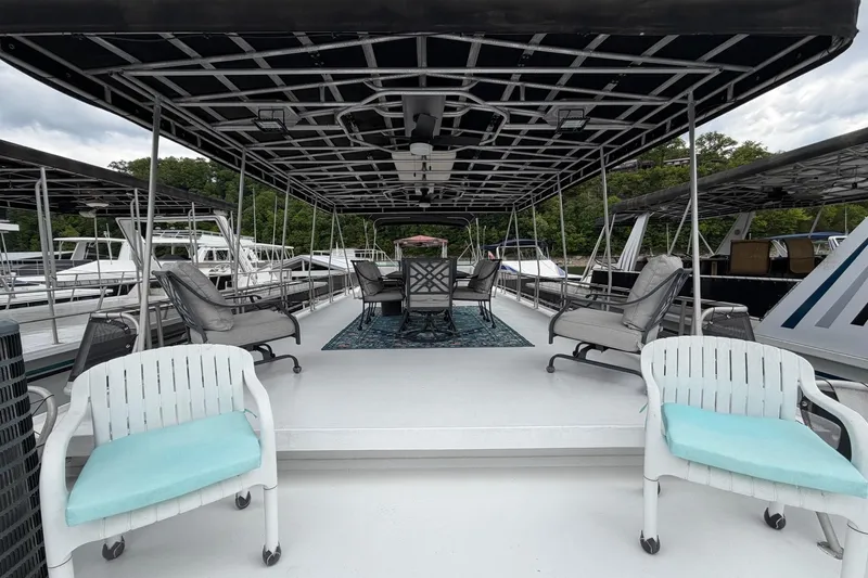 Slide: The Image of Spacious deck of 1988 STARDUST 16x70 houseboat with seating and canopy. - 49