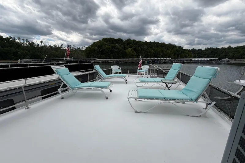 Slide: The Image of Upper deck of 1988 STARDUST 16x70 houseboat with lounge chairs and scenic lake view. - 51
