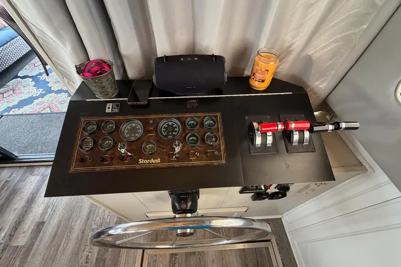 Slide: The Image of Control panel of a 1988 STARDUST 16x70 boat with gauges and levers. - 9