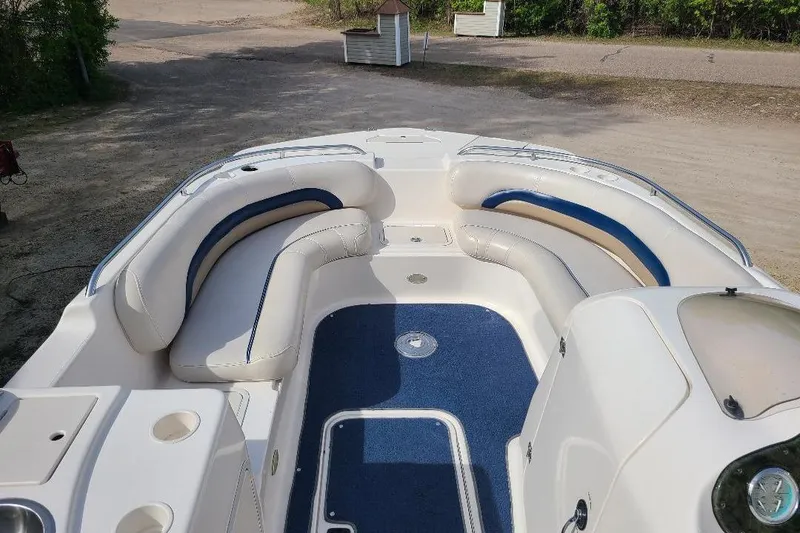 Slide: The Image of 2006 Hurricane FunDeck GS 232 IO boat interior with blue and white seating. - 2