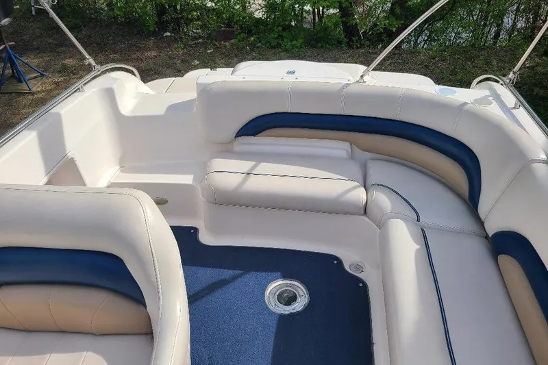 Slide: The Image of 2006 Hurricane FunDeck GS 232 IO boat interior with white and blue seating. - 8