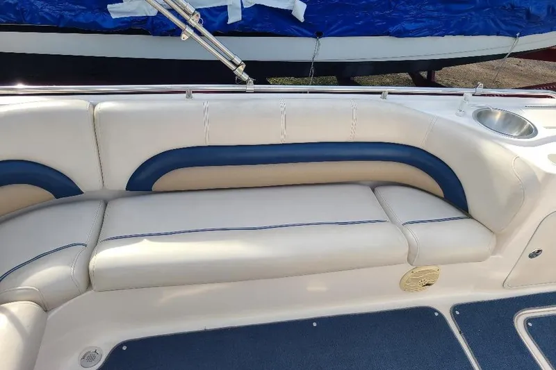 Slide: The Image of 2006 Hurricane FunDeck GS 232 IO boat interior with white and blue seating. - 7