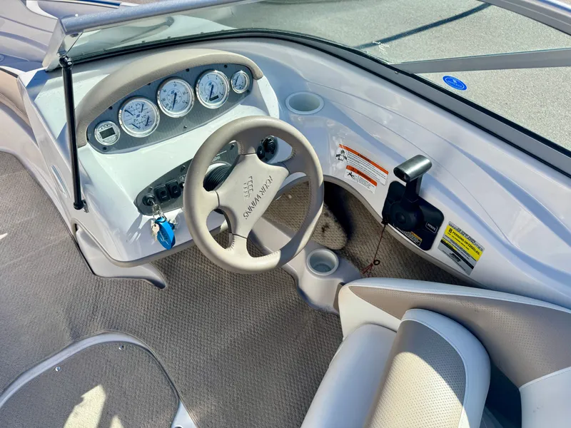 Slide: The Image of Interior view of 2006 Four Winns 190 Horizon boat cockpit. - 12
