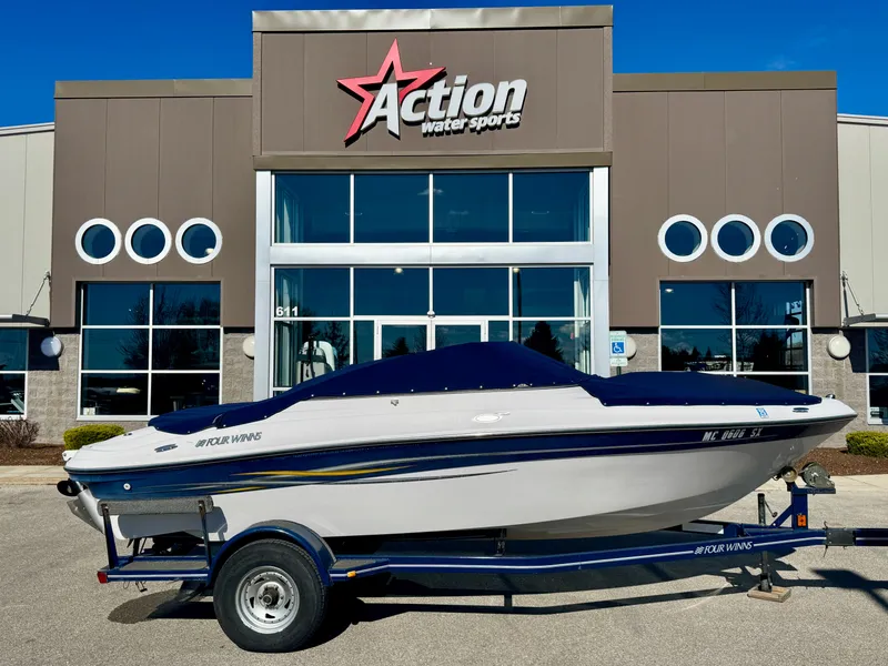 Slide: The Image of 2006 Four Winns 190 Horizon boat in front of Action Water Sports building. - 19