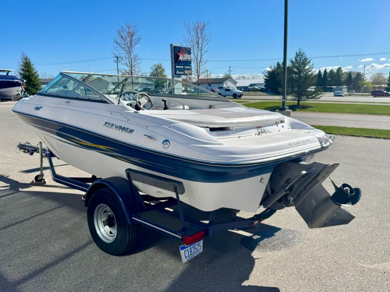 Slide: The Image of 2006 Four Winns 190 Horizon boat on trailer outdoors. - 6