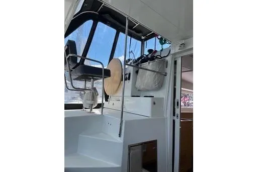 Slide: The Image of 2018 Lagoon 400 S2 yacht interior with helm station and seating area. - 11