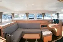 Slide: The Image of 2018 Lagoon 400 S2 yacht interior with modern seating and navigation area. - 12