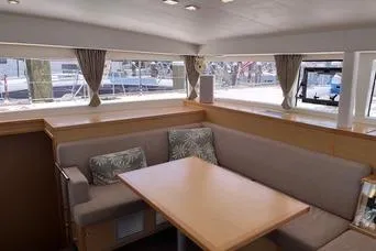 Slide: The Image of Interior of 2018 Lagoon 400 S2 catamaran with cozy seating and large windows. - 14