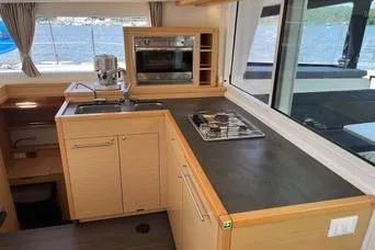 Slide: The Image of Modern kitchen interior of 2018 Lagoon 400 S2 yacht with ocean view. - 15