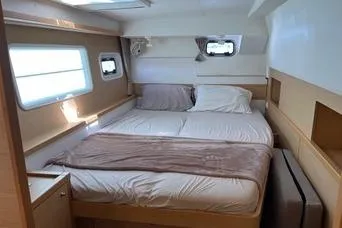 Slide: The Image of 2018 Lagoon 400 S2 yacht cabin with cozy double bed and natural light. - 17