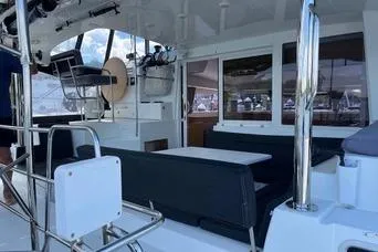 Slide: The Image of 2018 Lagoon 400 S2 yacht interior with seating and helm station. - 25