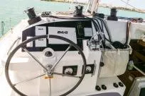 Slide: The Image of Steering wheel of 2018 Lagoon 400 S2 catamaran with control panel and ocean backdrop. - 30