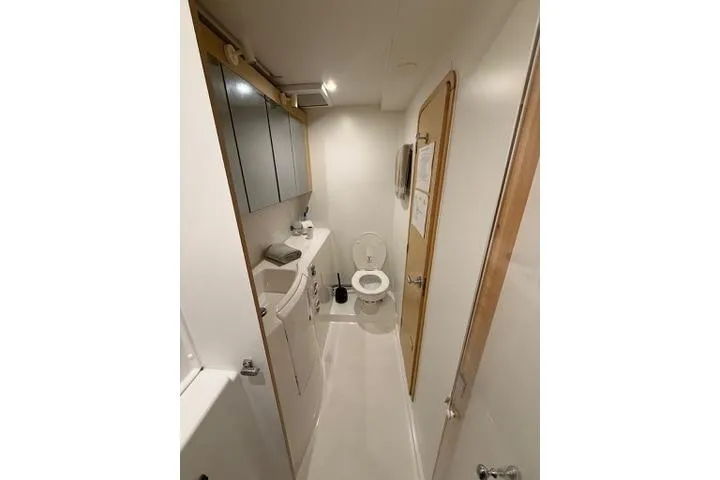 Slide: The Image of Bathroom interior of 2018 Lagoon 400 S2 yacht, featuring modern fixtures and compact design. - 37