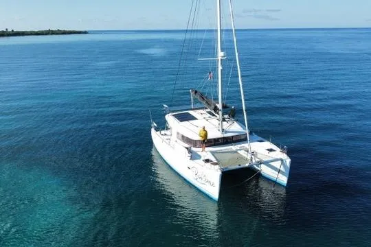 Slide: The Image of 2018 Lagoon 400 S2 catamaran sailing on calm blue waters. - 41