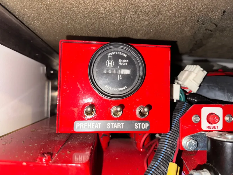 Slide: The Image of Westerbeke engine hour meter on red panel, 2008 Formula 37 Cruiser. - 33