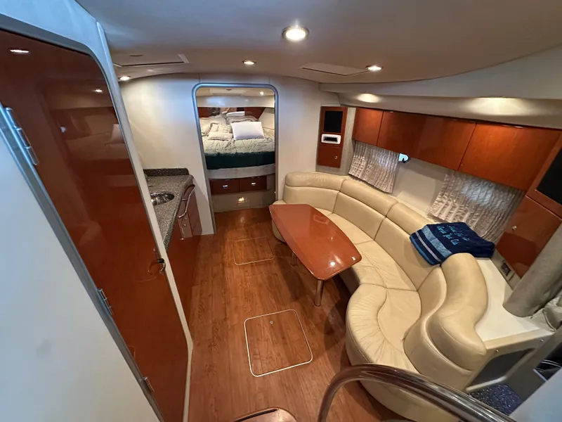 Slide: The Image of Interior of a 2008 Formula 37 Performance Cruiser with leather sofa and wooden table. - 41