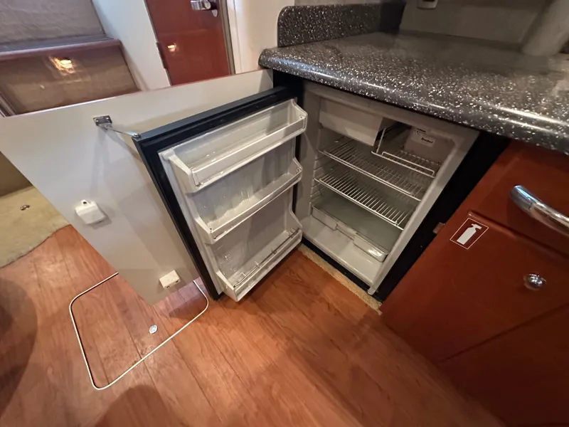 Slide: The Image of 2008 Formula 37 Performance Cruiser kitchen area with open refrigerator. - 44
