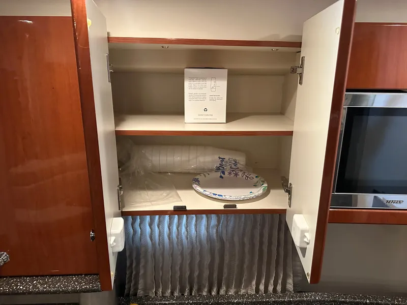 Slide: The Image of Open kitchen cabinet in a 2008 Formula 37 Performance Cruiser. - 46