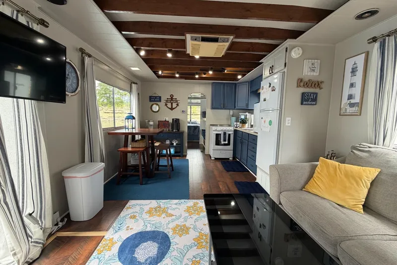 Slide: The Image of Interior of a 1987 Jamestowner houseboat with cozy decor and modern kitchen. - 11