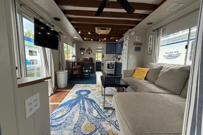 Slide: The Image of Cozy 1987 Jamestowner houseboat interior with nautical decor and modern amenities. - 5