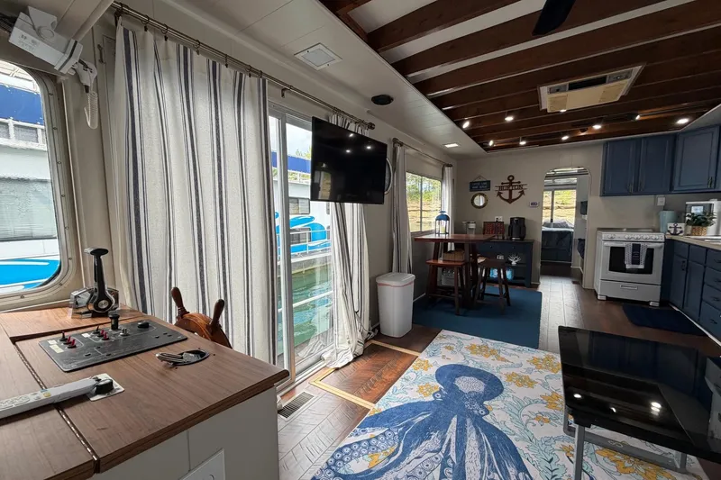 Slide: The Image of Interior of a 1987 Jamestowner 14x60 houseboat with nautical decor and modern amenities. - 8