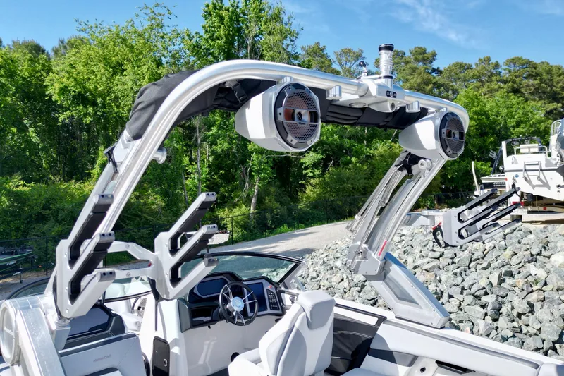 Slide: The Image of 2022 MasterCraft XStar boat with advanced audio system and sleek design. - 10