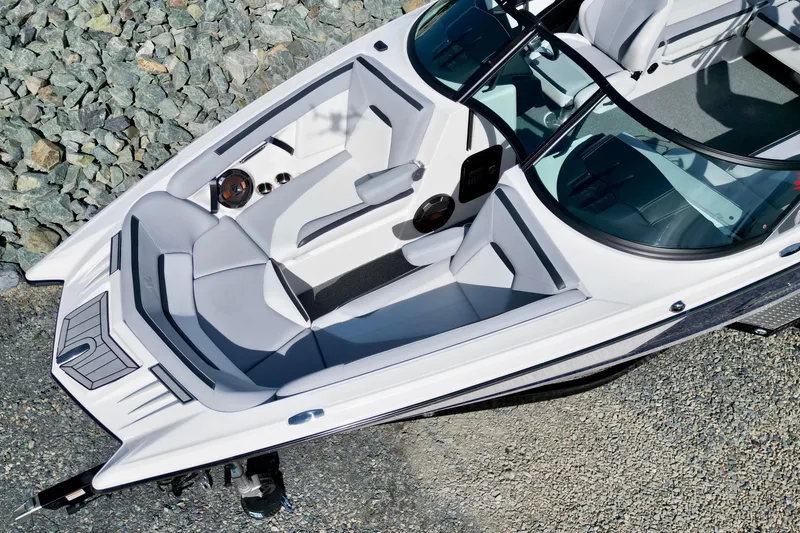 Slide: The Image of 2022 MasterCraft XStar boat interior with sleek seating and modern design. - 12