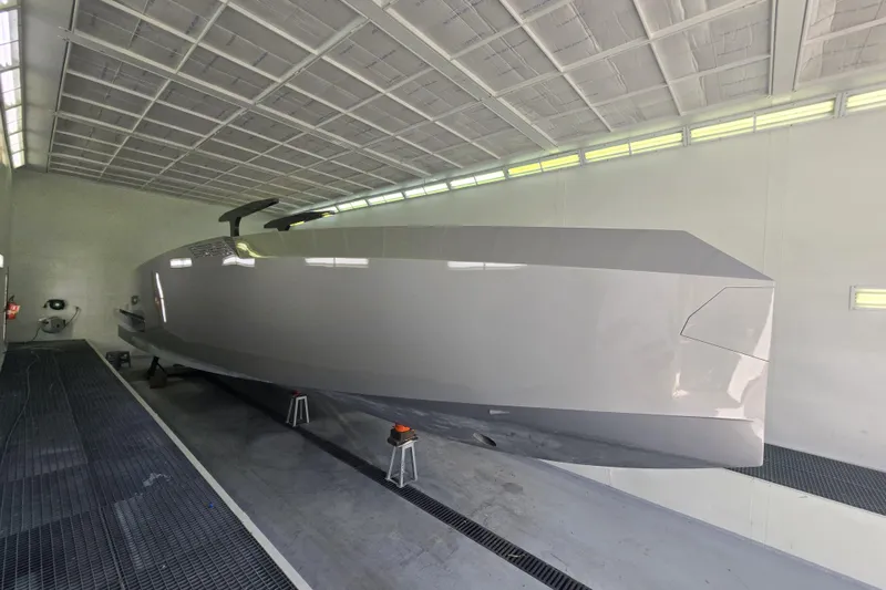 Slide: The Image of Alium 42 Yacht 2026 in dry dock, sleek modern design. - 3