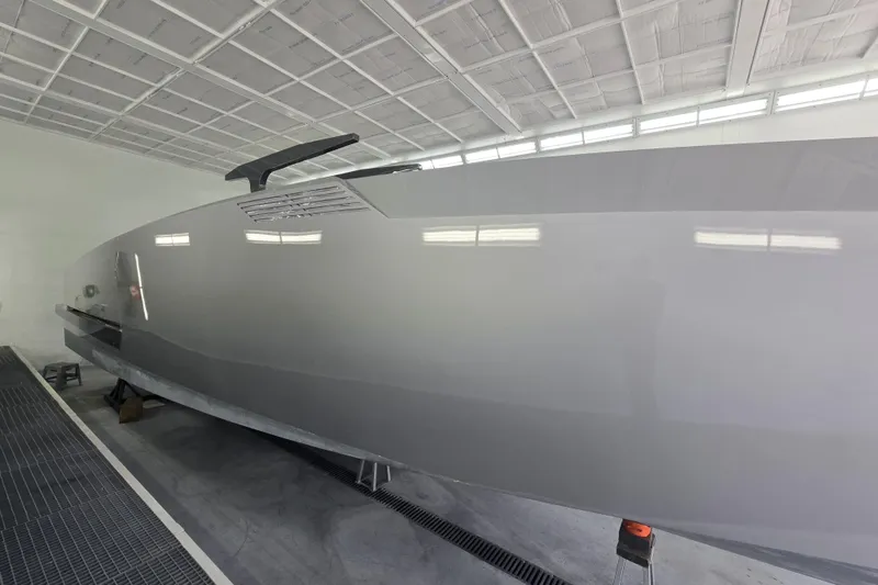 Slide: The Image of Alium 42 Yacht 2026 in modern shipyard setting. - 5
