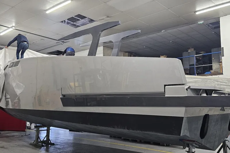 Slide: The Image of Alium 42 Yacht 2026 under construction in a workshop. - 6