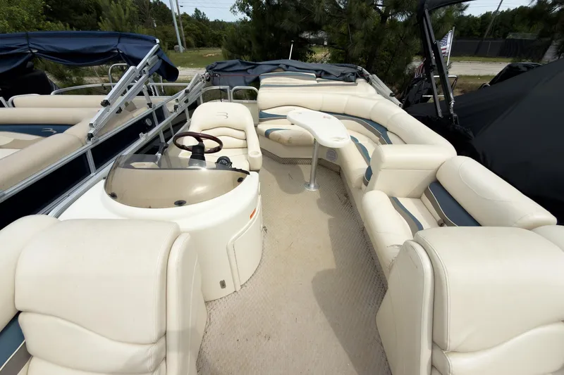 Slide: The Image of 2006 Bennington 2275RL pontoon boat with spacious seating and helm, ideal for leisure cruising. - 4