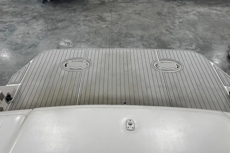 Slide: The Image of 2001 Formula 330 Sun Sport boat deck with non-slip surface in a garage setting. - 11