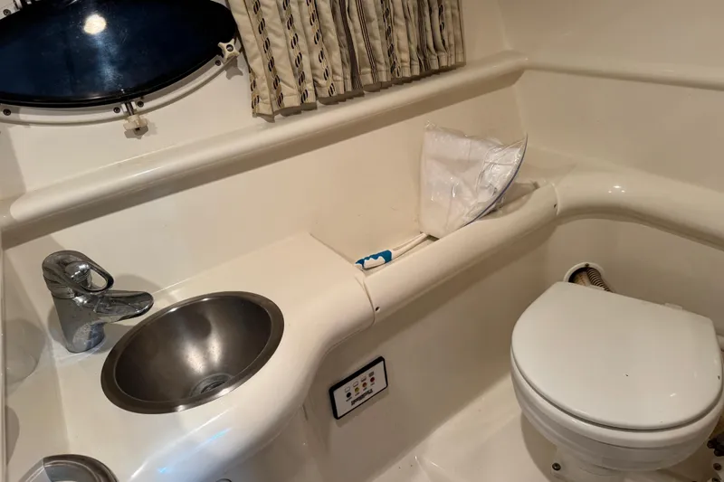 Slide: The Image of 2001 Formula 330 Sun Sport boat bathroom with sink and toilet. - 13